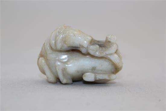 A Chinese white and black jade group of a monkey and a recumbent horse, 19th century, 4cm.